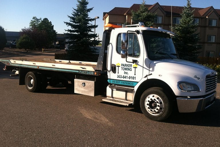 Parker Towing flatbed truck on the road