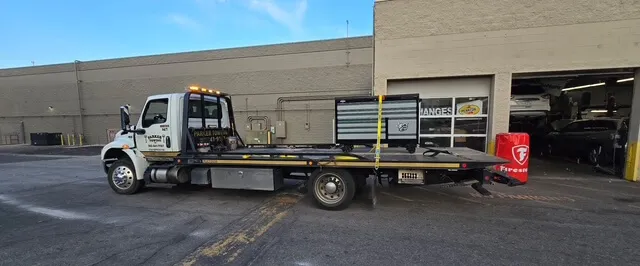 A Parker Towing flatbed tow truck ready to load